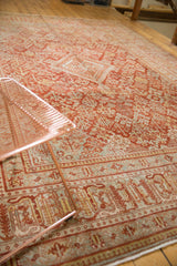 Distressed vintage Joshegan rug border and lattice field with even wear and cinnabar hues.