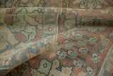 Even wear to the knot heads on a distressed Tabriz carpet in dusty rose and slate blue.