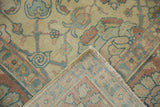 Hand-knotted weave and distressed low pile of a vintage Tabriz carpet's folded corner.