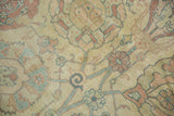 Even wear to the knot heads on a vintage Tabriz with floral motifs in dusty rose and slate blue.
