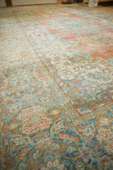Soft, worn texture of a distressed vintage Mahal rug with brick, blue, and ivory Rococo florals.