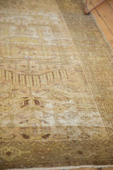 Textured golden beige distressed Hamadan rug showing wear and visible foundation.