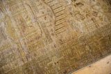 Distressed Hamadan rug corner: gold, beige, olive, Samovar / Turtle border, visible wear.