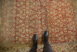 Distressed Bijar rug showcasing even wear and abrashes across the earthy Herati motif.