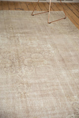Faded Rococo pattern and softly worn texture on a vintage Turkish Sparta rug.