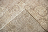 Visible hand-knotted foundation and distressed pile of the vintage Sparta carpet.
