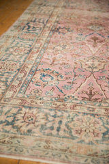 Soft pink and blue distressed texture with palmette motifs on vintage Sparta rug.