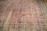 Distressed pink Sparta carpet border with faded indigo and seafoam floral palmettes.