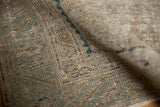 Distressed texture and visible foundation on a vintage Malayer carpet in muted ivory, blue tones.