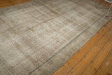 Visible worn foundation texture on vintage distressed Malayer rug, with subtle blue border.
