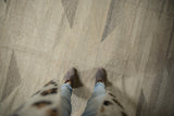 Ivory and gray geometric pyramid patterns on a hand woven contemporary Kilim.