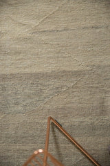 Hand-woven wool texture of the contemporary Kilim, with subtle ivory and gray pyramid motifs.