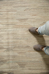 Hand woven Kilim carpet featuring abrashed striations in undyed ivory, gray, and beige.