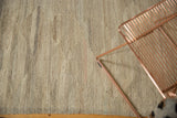 Hand-woven Indian Kilim texture with subtle ivory, beige, and gray striations.
