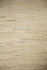 Hand woven Kilim flatweave showcasing abrashed ivory, beige, and silver striations.