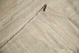 Textural close-up of New Kilim carpet's natural undyed ivory, gray, beige striations.