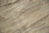 Detail of hand woven Kilim carpet texture, featuring undyed wool with ivory, silver, beige striations.