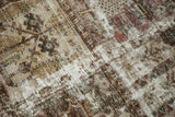 Distressed vintage Bakhtiari carpet close-up, revealing exposed foundation with faded colors.