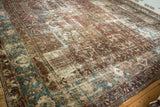 Distressed vintage Bakhtiari carpet with worn paneled motifs in blue, wine red, and ivory tones.