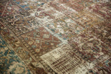 Distressed Bakhtiari carpet showing decorative worn texture, exposed foundation, softened red, blue, gold.