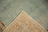 Hand-knotted back and original side selvage of a vintage distressed Tabriz rug.