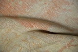 Hand-knotted distressed vintage Oushak rug texture, exposed foundation, peach and ivory.