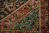 Distressed Bakhtiari rug texture with pale terracotta, dusty dark teal, and foundation showing.