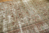 Distressed vintage Mahal carpet fragment, showing textured wear, Herati motif, and layered border.