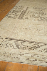 Distressed hand-knotted Oushak rug pile texture with softened chocolate brown geometric motifs.