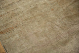 Distressed Oushak carpet pile showing mostly even wear with antique ivory, beige, and copper tones.