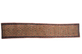 Antique Caucasian runner rug, late 19th century, with colorful geometric plant motifs, 1'8