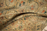 Soft, distressed pile of a Turkmen runner featuring geometric gul patterns in beige and terra cotta.