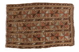 Vintage Belouch rug featuring triple column floral cross sections in camel, madder red, and grey tones.