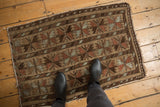 Belouch rug oversize floral cross sections: madder red, oxidized silver, camel hair.