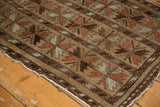 Vintage Belouch rug corner, triple column floral cross sections in camel, red, and oxidized silver.
