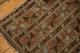 Hand-knotted Belouch rug pattern in camel, madder red, and oxidized silver.