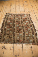 Vintage Belouch rug with triple column floral patterns: camel, red, oxidized silver.