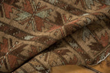 Belouch rug pile texture showing camel, madder red, and silver floral motifs.