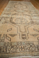 Close-up of distressed Serab runner, showing geometric stepped patterns, visible abrash, and texture.