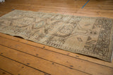 Distressed vintage Serab runner with geometric motifs, abrash, and time-softened tones.