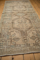 Distressed geometric pattern and texture in ivory and seafoam on a vintage Serab runner.