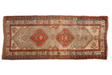 Vintage Persian Serab hand-knotted runner, double madder red mahi-mahi medallions, intricate ivory field.