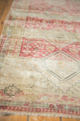 Close-up of the even wear and stepped medallion contour on a vintage distressed Shiraz rug.