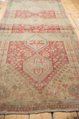 Angled perspective of the distressed Shiraz runner highlighting the raspberry medallion column.