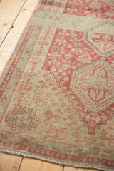 Side view of the vintage Persian Shiraz runner, showing the intact selvage and worn texture.