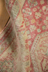 Close-up of a vintage Shiraz runner's hand-knotted weave and time-softened pile.