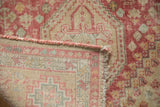 Hand-knotted back and restored side cord visible on the corner of a vintage Shiraz runner.