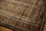 Distressed Belouch rug with geometric pattern, high luster wool, and even wear to knot heads.
