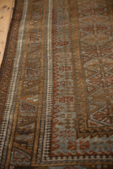 Fine knotting with distressed geometric patterns in slate blue, coffee bronze, and chestnut.