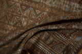 Distressed high-luster pile featuring geometric floral guls in bronze, slate blue, oxidized silver.